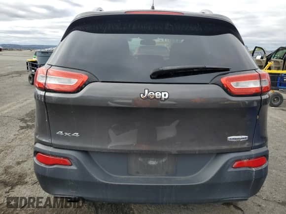 2014 Jeep Cherokee Latitude with VIN 1C4PJMCB9EW315772, listed as a Copart auction lot 86169155 with 107,636 mi miles and Salvage title. Bid and sale history available at DreamBid. Image 6.