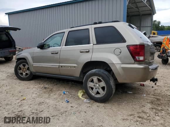 2006 Jeep Grand Cherokee Limited with VIN 1J4HS58N66C211974, listed as a Copart auction lot 60281945 with 220,229 mi miles and Salvage title. Bid and sale history available at DreamBid. Image 2.