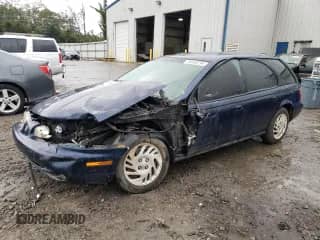 1999 Saturn SW with VIN 1G8ZK8273XZ244364, listed as a Copart auction lot 84493794 with 172,284 mi miles and Salvage title. Bid and sale history available at DreamBid. Image 1.