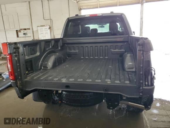 2023 Ford F-150 XL with VIN 1FTFW1E58PKG09418, listed as a Copart auction lot 57287655 with 32,945 mi miles and Salvage title. Bid and sale history available at DreamBid. Image 6.