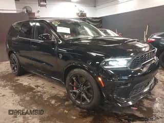 2023 Dodge Durango SRT Hellcat with VIN 1C4SDJH98PC585330, listed as a IAAI auction lot 41047195 with 7,744 mi miles and . Bid and sale history available at DreamBid. Image 1.