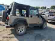 2004 Jeep Wrangler SE with VIN 1J4FA29144P735859, listed as a Copart auction lot 69126375 with 148,557 mi miles and Salvage title. Bid and sale history available at DreamBid. Image 3.