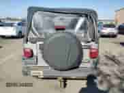 2000 Jeep Wrangler SE with VIN 1J4FA29P4YP775935, listed as a Copart auction lot 80458955 with 100,211 mi miles and Salvage title. Bid and sale history available at DreamBid. Image 6.