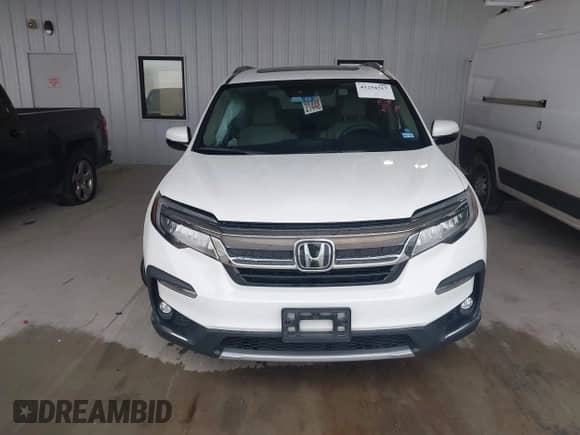 2020 Honda Pilot Touring 7-Passenger z VIN 5FNYF5H60LB026398, wystawiony jako IAAI lot #41294517 z przebiegiem 52 917 mil mil oraz . Historia ofert i sprzedaży dostępna na DreamBid. Obrazek 12.