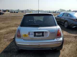 2004 MINI Hardtop with VIN WMWRC33454TJ56308, listed as a Copart auction lot 59690865 with 99,374 mi miles and Salvage title. Bid and sale history available at DreamBid. Image 6.