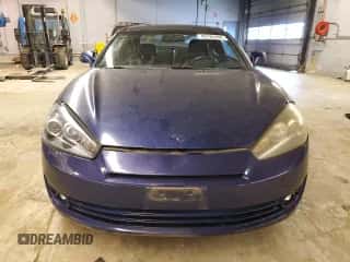 2007 Hyundai Tiburon GT с VIN KMHHN66F77U246951, выставлен на аукционе Copart как лот 83765444 с пробегом 95 582 миль миль и Списание • Salvage title. История ставок и продаж доступна на DreamBid. Изображение 5.