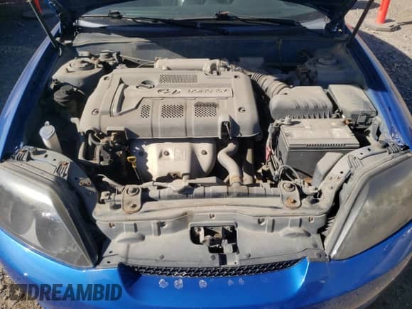 2006 Hyundai Tiburon SE с VIN KMHHN65D06U230928, выставлен на аукционе Copart как лот 72745854 с пробегом 246 837 миль миль и Чистый • Clean title. История ставок и продаж доступна на DreamBid. Изображение 11.