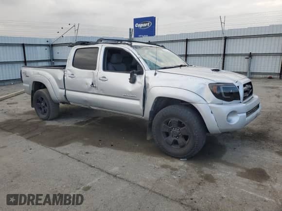 2008 Toyota Tacoma PreRunner with VIN 3TMKU72N98M015846, listed as a Copart auction lot 82139065 with 210,053 mi miles and Salvage title. Bid and sale history available at DreamBid. Image 4.