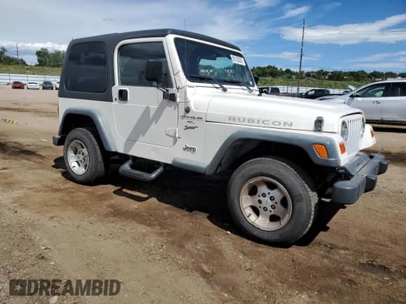 2000 Jeep Wrangler Sport z VIN 1J4FA49SXYP700513, wystawiony jako Copart lot #80155385 z przebiegiem 129 836 mil mil oraz Szkoda całkowita • Salvage title. Historia ofert i sprzedaży dostępna na DreamBid. Obrazek 4.