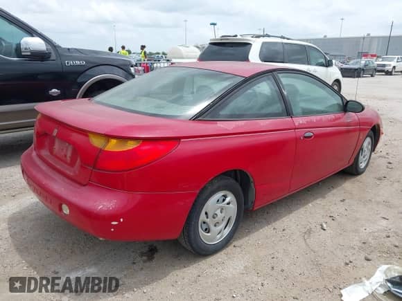 2002 Saturn SC with VIN 1G8ZP14892Z104603, listed as a IAAI auction lot 42116571 with 119,959 mi miles and . Bid and sale history available at DreamBid. Image 4.