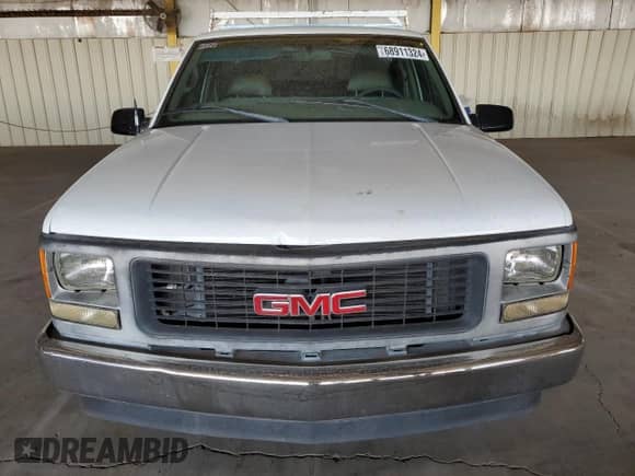1998 GMC Sierra 1500 z VIN 1GTEC14M6WZ850008, wystawiony jako Copart lot #68911324 z przebiegiem 110 409 mil mil oraz Szkoda całkowita • Salvage title. Historia ofert i sprzedaży dostępna na DreamBid. Obrazek 5.