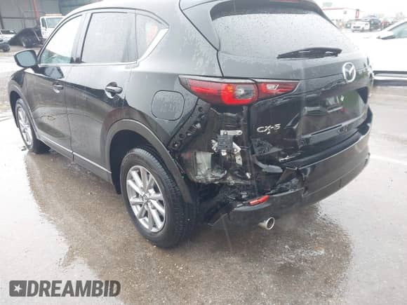 2023 Mazda CX-5 S Carbon Edition z VIN JM3KFBCM3P0126856, wystawiony jako IAAI lot #42020069 z przebiegiem 9 728 mil mil oraz . Historia ofert i sprzedaży dostępna na DreamBid. Obrazek 6.