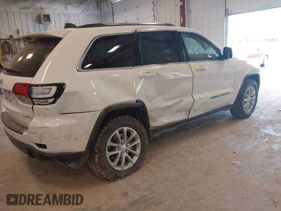 2021 Jeep Grand Cherokee Laredo E with VIN 1C4RJFAG0MC569163, listed as a IAAI auction lot 42653930 with 66,739 mi miles and . Bid and sale history available at DreamBid. Image 4.