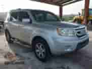 2009 Honda Pilot Touring with VIN 5FNYF38839B022943, listed as a IAAI auction lot 42443006 with 199,184 mi miles and . Bid and sale history available at DreamBid. Image 1.