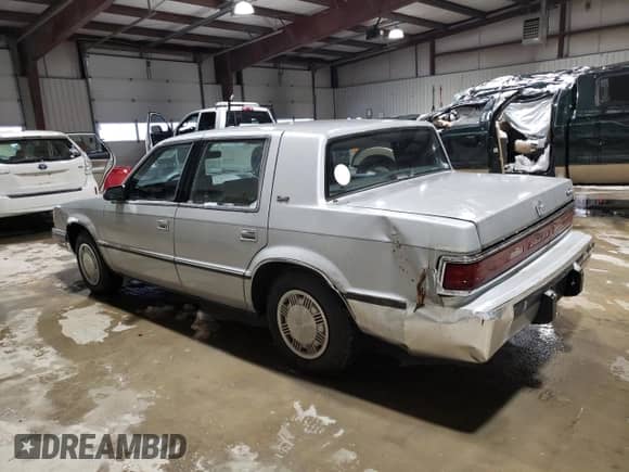1989 Dodge Dynasty with VIN 1B3BC4634KD442902, listed as a Copart auction lot 85151394 with 63,120 mi miles and Clean title. Bid and sale history available at DreamBid. Image 2.
