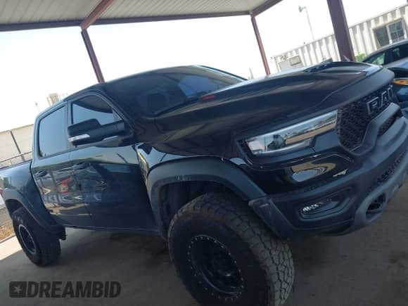 2022 Ram 1500 TRX with VIN 1C6SRFU90NN369047, listed as a IAAI auction lot 42562232 with 14,501 mi miles and . Bid and sale history available at DreamBid. Image 13.