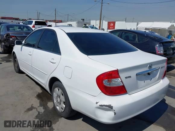 2002 Toyota Camry LE с VIN JTDBE32K720020808, выставлен на аукционе IAAI как лот 41849196 с пробегом 150 546 миль миль и . История ставок и продаж доступна на DreamBid. Изображение 3.