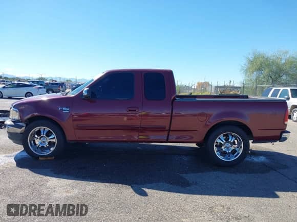 1999 Ford F-150 with VIN 1FTRX17W3XKB03527, listed as a IAAI auction lot 43450405 with 121,752 mi miles and . Bid and sale history available at DreamBid. Image 14.