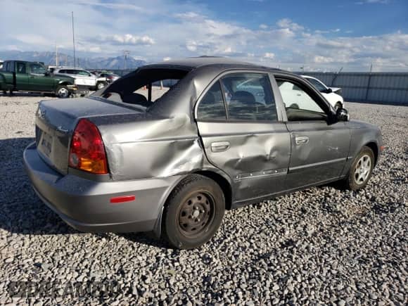 2003 Hyundai Accent GL с VIN KMHCG45CX3U482360, выставлен на аукционе Copart как лот 68657183 с пробегом Не указан миль и Списание • Salvage title. История ставок и продаж доступна на DreamBid. Изображение 3.