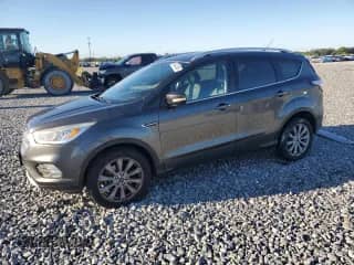 2017 Ford Escape Titanium with VIN 1FMCU9JD9HUE56943, listed as a Copart auction lot 86434385 with 92,098 mi miles and Salvage title. Bid and sale history available at DreamBid. Image 1.