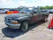 2004 Dodge Dakota SLT with VIN 1D7GL42K64S657235, listed as a IAAI auction lot 42121847 with 157,557 mi miles and . Bid and sale history available at DreamBid. Image 2.