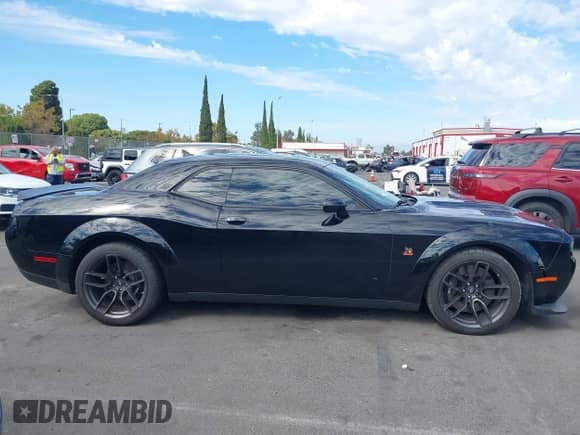 2021 Dodge Challenger R/T Scat Pack Widebody with VIN 2C3CDZFJ7MH677011, listed as a IAAI auction lot 43412091 with 26,783 mi miles and . Bid and sale history available at DreamBid. Image 14.