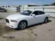2014 Dodge Charger SE with VIN 2C3CDXBG3EH213598, listed as a Copart auction lot 59285085 with 218,261 mi miles and Clean title. Bid and sale history available at DreamBid. Image 1.