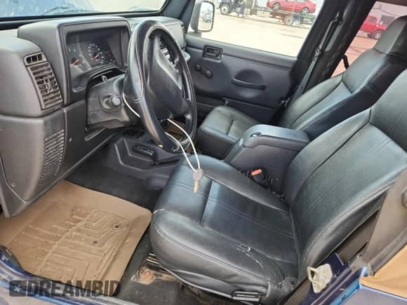 2003 Jeep Wrangler X z VIN 1J4FA39S33P356428, wystawiony jako Copart lot #70285135 z przebiegiem 147 788 mil mil oraz Szkoda całkowita • Salvage title. Historia ofert i sprzedaży dostępna na DreamBid. Obrazek 7.