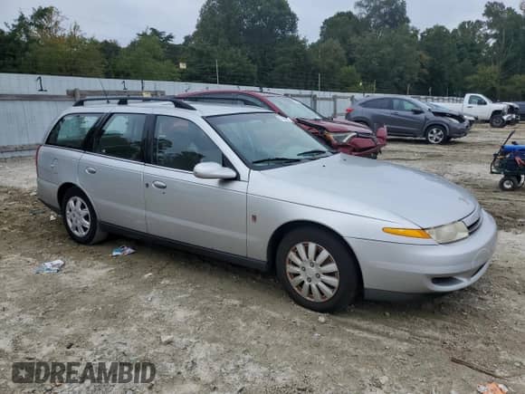 2001 Saturn LW with VIN 1G8JU82F71Y577940, listed as a Copart auction lot 71680985 with 233,817 mi miles and Salvage title. Bid and sale history available at DreamBid. Image 4.