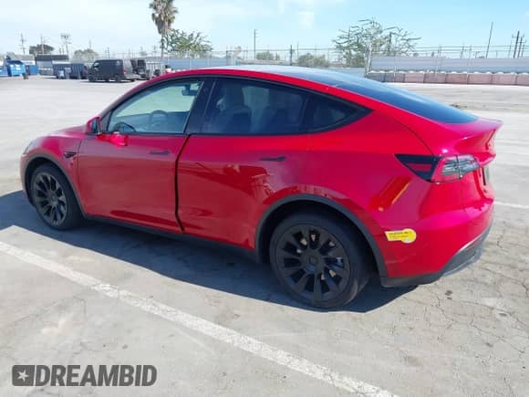 2022 Tesla Model Y Long Range z VIN 7SAYGDEE2NF352440, wystawiony jako IAAI lot #43041054 z przebiegiem 46 950 mil mil oraz . Historia ofert i sprzedaży dostępna na DreamBid. Obrazek 3.