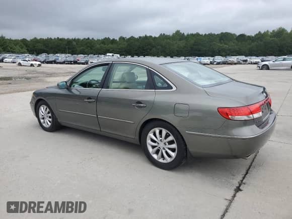 2006 Hyundai Azera SE with VIN KMHFC46FX6A135022, listed as a Copart auction lot 69843315 with 218,656 mi miles and Salvage title. Bid and sale history available at DreamBid. Image 2.
