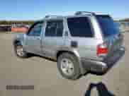 1999 Nissan Pathfinder XE z VIN JN8AR07Y7XW385686, wystawiony jako Copart lot #82694075 z przebiegiem 160 620 mil mil oraz Szkoda całkowita • Salvage title. Historia ofert i sprzedaży dostępna na DreamBid. Obrazek 2.