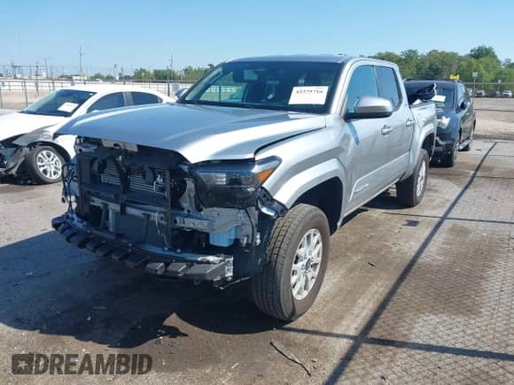 2024 Toyota Tacoma TRD Off Road with VIN 3TMLB5JN8RM010395, listed as a IAAI auction lot 43375716 with 20,319 mi miles and . Bid and sale history available at DreamBid. Image 2.