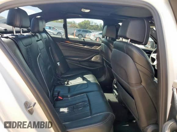 2018 BMW 5 Series M550i xDrive with VIN WBAJB9C54JB034746, listed as a Copart auction lot 71218435 with 128,279 mi miles and Clean title. Bid and sale history available at DreamBid. Image 10.