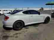 2003 Hyundai Tiburon GT z VIN KMHHN65F73U101856, wystawiony jako Copart lot #64248815 z przebiegiem 59 622 mil mil oraz Szkoda całkowita • Salvage title. Historia ofert i sprzedaży dostępna na DreamBid. Obrazek 3.