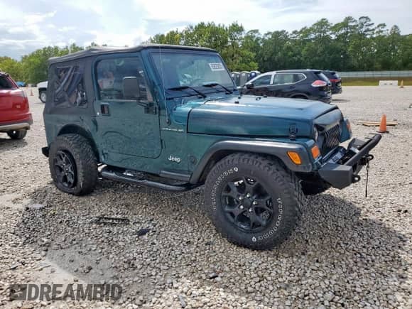 1999 Jeep Wrangler Sport with VIN 1J4FY19S7XP435204, listed as a Copart auction lot 83820835 with 263,738 mi miles and Clean title. Bid and sale history available at DreamBid. Image 4.