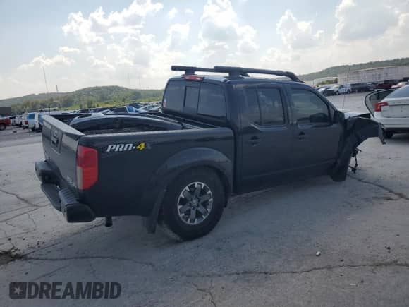 2021 Nissan Frontier Pro-4X with VIN 1N6ED0EBXMN704555, listed as a Copart auction lot 71824015 with 76,858 mi miles and Salvage title. Bid and sale history available at DreamBid. Image 3.