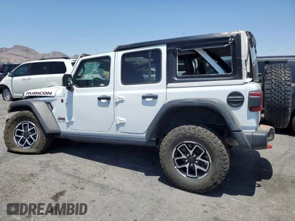 2024 Jeep Wrangler Rubicon z VIN 1C4PJXFG1RW300794, wystawiony jako Copart lot #60173765 z przebiegiem 22 652 mil mil oraz Czysty tytuł • Clean title. Historia ofert i sprzedaży dostępna na DreamBid. Obrazek 2.