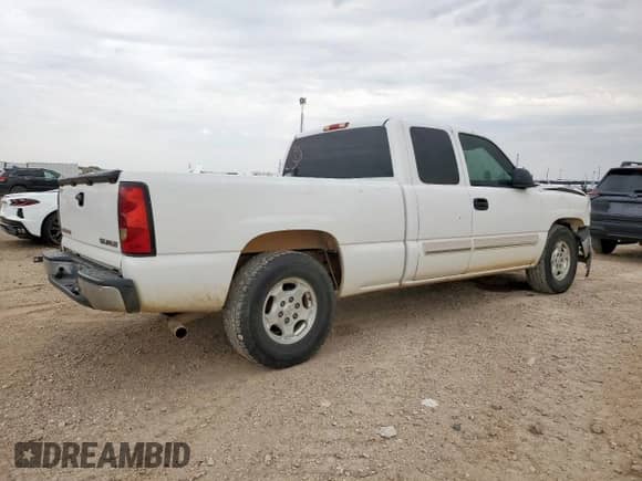 2004 Chevrolet Silverado 1500 Work Truck with VIN 2GCEC19V641173274, listed as a Copart auction lot 70104735 with 184,952 mi miles and Salvage title. Bid and sale history available at DreamBid. Image 3.