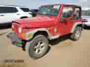 2003 Jeep Wrangler X z VIN 1J4FA39S33P308881, wystawiony jako Copart lot #69323655 z przebiegiem 264 257 mil mil oraz Szkoda całkowita • Salvage title. Historia ofert i sprzedaży dostępna na DreamBid. Obrazek 1.