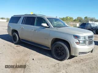 2015 Chevrolet Suburban with VIN 1GNSK5EC1FR682675, listed as a IAAI auction lot 43283608 with 203,132 mi miles and . Bid and sale history available at DreamBid. Image 1.