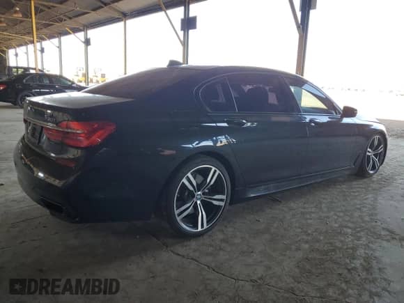 2016 BMW 7 Series 750i с VIN WBA7F0C56GGL99824, выставлен на аукционе Copart как лот 62845125 с пробегом 114 694 миль миль и Списание • Salvage title. История ставок и продаж доступна на DreamBid. Изображение 3.