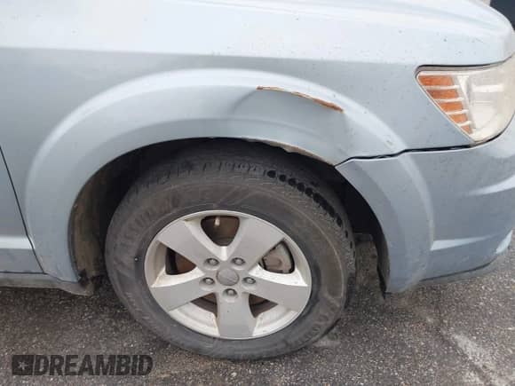 2013 Dodge Journey American Value z VIN 3C4PDCAB6DT665336, wystawiony jako IAAI lot #43511976 z przebiegiem 185 019 mil mil oraz . Historia ofert i sprzedaży dostępna na DreamBid. Obrazek 6.