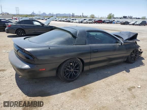 1997 Chevrolet Camaro Z28 с VIN 2G1FP22PXV2141166, выставлен на аукционе Copart как лот 61597885 с пробегом Не указан миль и Списание • Salvage title. История ставок и продаж доступна на DreamBid. Изображение 3.