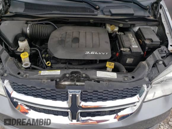 2013 Dodge Grand Caravan SE with VIN 2C4RDGBGXDR651484, listed as a Copart auction lot 56409815 with 246,308 mi miles and Clean title. Bid and sale history available at DreamBid. Image 12.