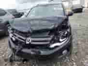 2014 Volkswagen Tiguan SEL with VIN WVGAV3AX7EW101796, listed as a Copart auction lot 60904345 with 97,652 mi miles and Salvage title. Bid and sale history available at DreamBid. Image 5.