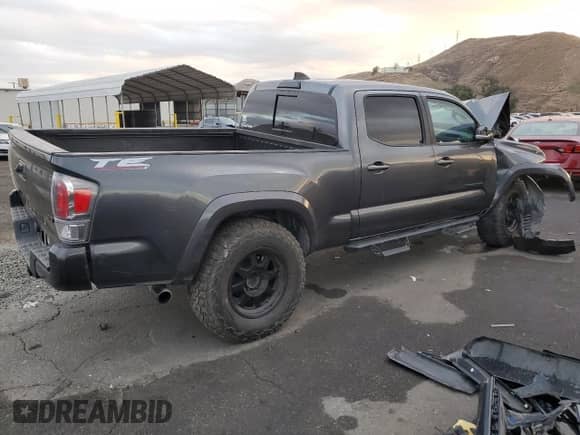 2021 Toyota Tacoma SR5 с VIN 3TMDZ5BN2MM108586, выставлен на аукционе Copart как лот 84925984 с пробегом 112 793 миль миль и Списание • Salvage title. История ставок и продаж доступна на DreamBid. Изображение 3.