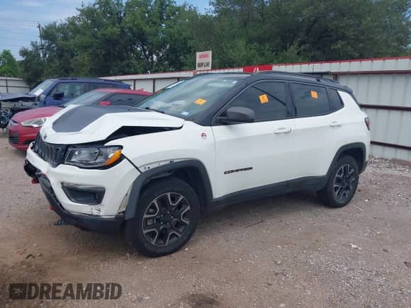 2019 Jeep Compass Trailhawk with VIN 3C4NJDDB5KT766401, listed as a IAAI auction lot 43050485 with 58,564 mi miles and . Bid and sale history available at DreamBid. Image 2.