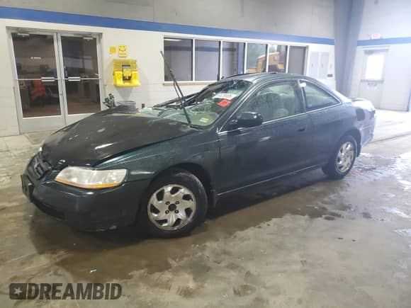 1999 Honda Accord EX with VIN 1HGCG3272XA026660, listed as a Copart auction lot 56629585 with 180,716 mi miles and Salvage title. Bid and sale history available at DreamBid. Image 1.