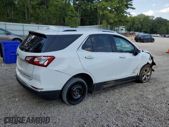 2020 Chevrolet Equinox Premier с VIN 3GNAXXEV9LS699792, выставлен на аукционе Copart как лот 70951615 с пробегом 104 428 миль миль и Списание • Salvage title. История ставок и продаж доступна на DreamBid. Изображение 3.